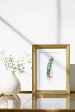 Image of a feather watercolor painting by Shayna Larsen, originals & prints available