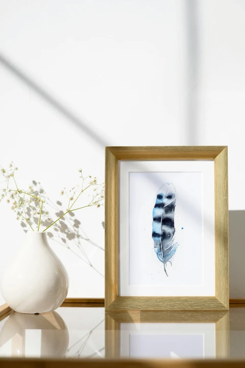 Image of a feather watercolor painting by Shayna Larsen, originals & prints available