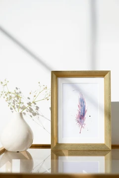 Image of a feather watercolor painting by Shayna Larsen, originals & prints available