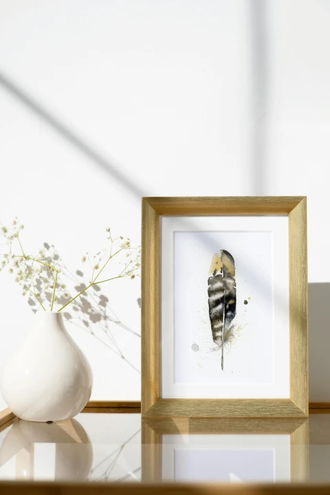 Image of a feather watercolor painting by Shayna Larsen, originals & prints available