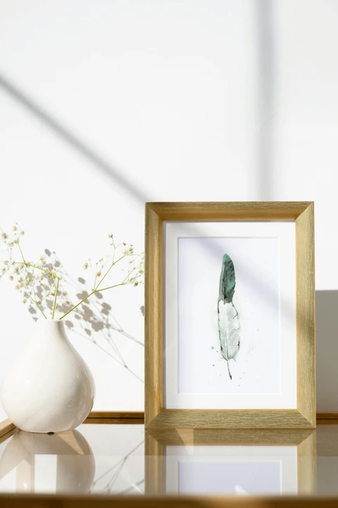 Image of a feather watercolor painting by Shayna Larsen, originals & prints available