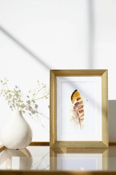 Image of a feather watercolor painting by Shayna Larsen, originals & prints available