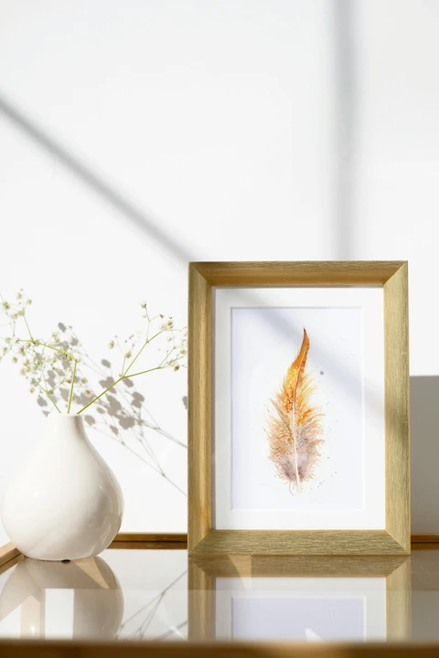 Image of a feather watercolor painting by Shayna Larsen, originals & prints available