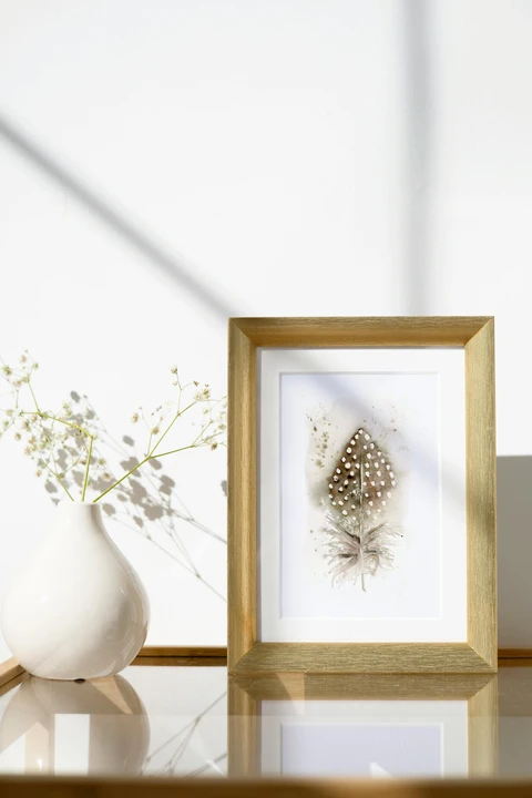 Image of a feather watercolor painting by Shayna Larsen, originals & prints available