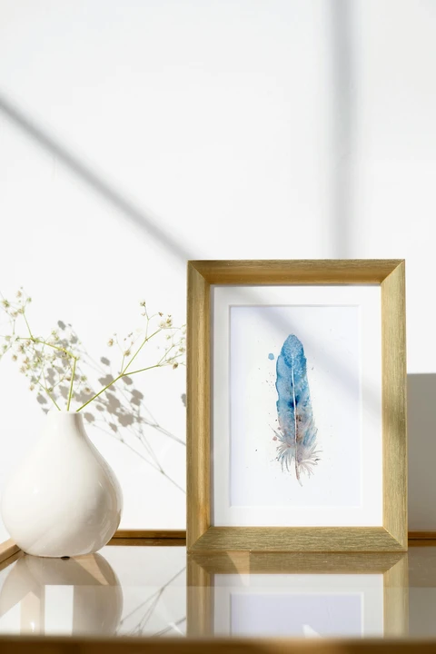 Image of a feather watercolor painting by Shayna Larsen, originals & prints available