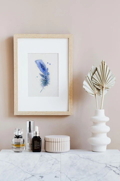 Image of a feather watercolor painting by Shayna Larsen, originals & prints available