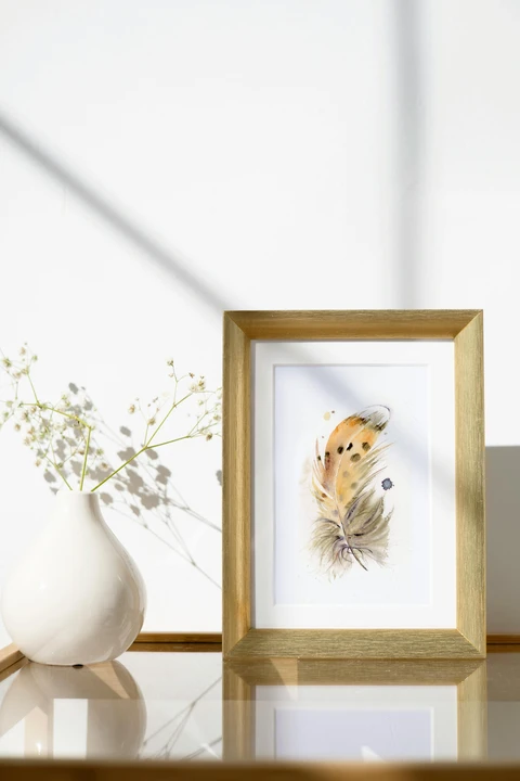 Image of a feather watercolor painting by Shayna Larsen, originals & prints available