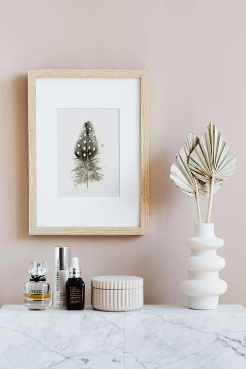 Image of a feather watercolor painting by Shayna Larsen, originals & prints available