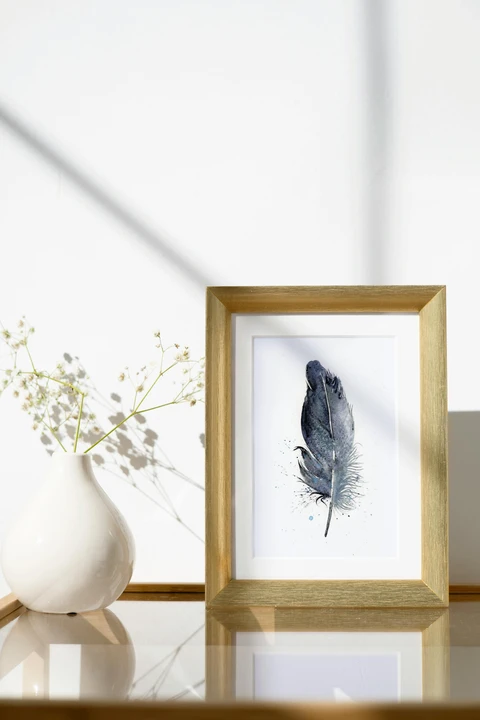Image of a feather watercolor painting by Shayna Larsen, originals & prints available