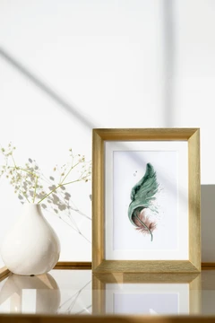 Image of a feather watercolor painting by Shayna Larsen, originals & prints available