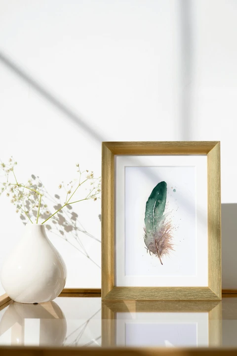 Image of a feather watercolor painting by Shayna Larsen, originals & prints available