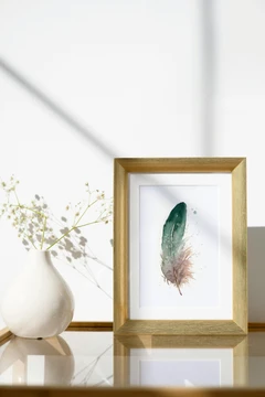 Image of a feather watercolor painting by Shayna Larsen, originals & prints available