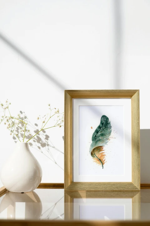Image of a feather watercolor painting by Shayna Larsen, originals & prints available