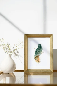 Image of a feather watercolor painting by Shayna Larsen, originals & prints available