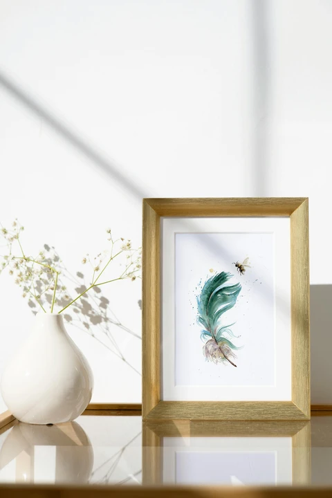 Image of a feather watercolor painting by Shayna Larsen, originals & prints available