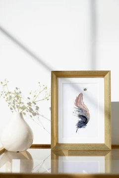 Image of a feather watercolor painting by Shayna Larsen, originals & prints available