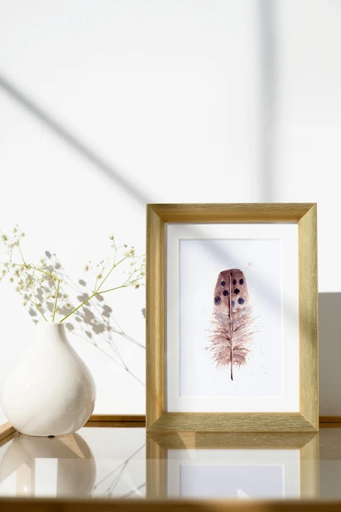 Image of a feather watercolor painting by Shayna Larsen, originals & prints available