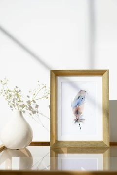 Image of a feather watercolor painting by Shayna Larsen, originals & prints available