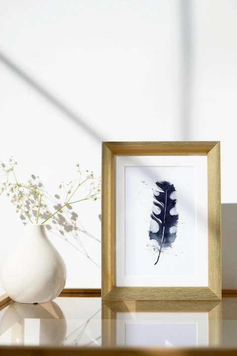 Image of a feather watercolor painting by Shayna Larsen, originals & prints available