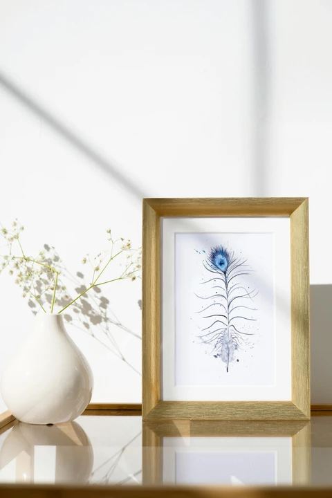 Image of a feather watercolor painting by Shayna Larsen, originals & prints available