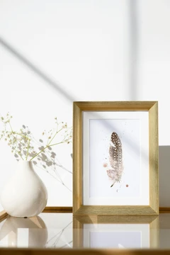 Image of a feather watercolor painting by Shayna Larsen, originals & prints available