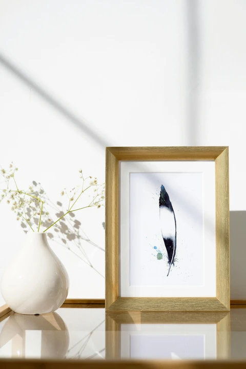 Image of a feather watercolor painting by Shayna Larsen, originals & prints available