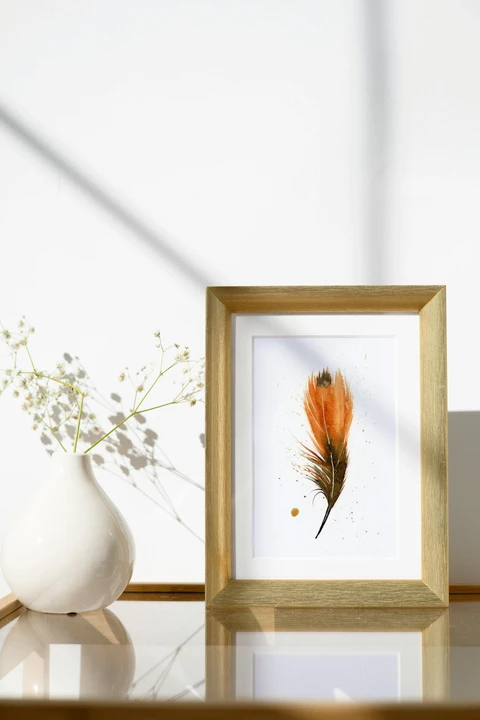 Image of a feather watercolor painting by Shayna Larsen, originals & prints available