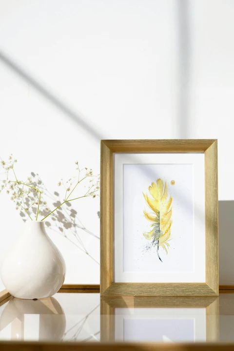 Image of a feather watercolor painting by Shayna Larsen, originals & prints available