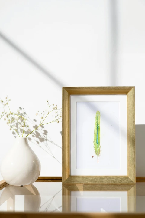 Image of a feather watercolor painting by Shayna Larsen, originals & prints available
