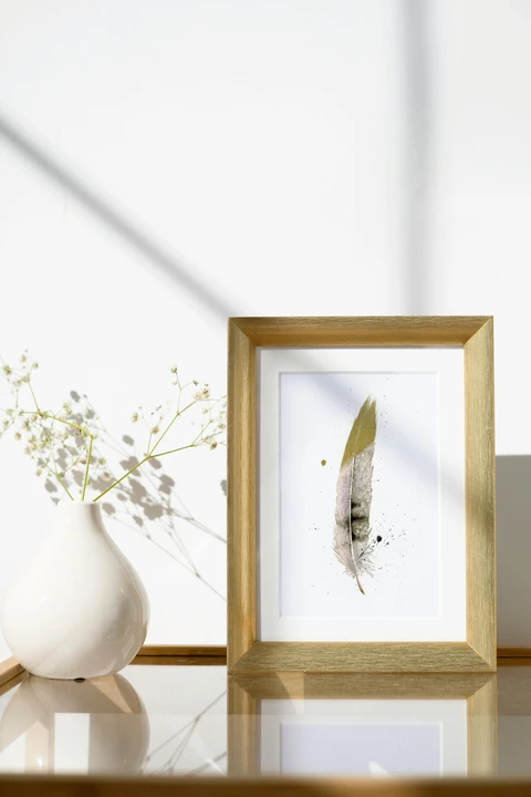 Image of a feather watercolor painting by Shayna Larsen, originals & prints available