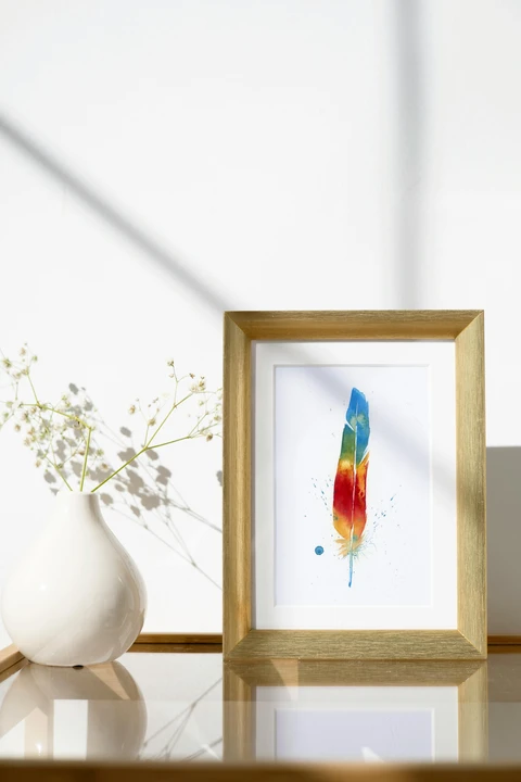 Image of a feather watercolor painting by Shayna Larsen, originals & prints available
