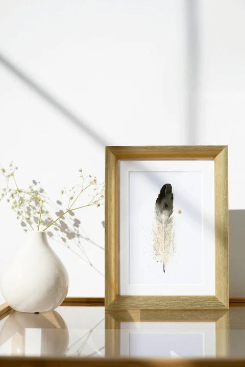 Image of a feather watercolor painting by Shayna Larsen, originals & prints available