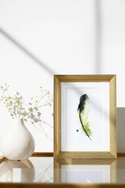 Image of a feather watercolor painting by Shayna Larsen, originals & prints available