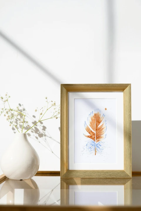 Image of a feather watercolor painting by Shayna Larsen, originals & prints available