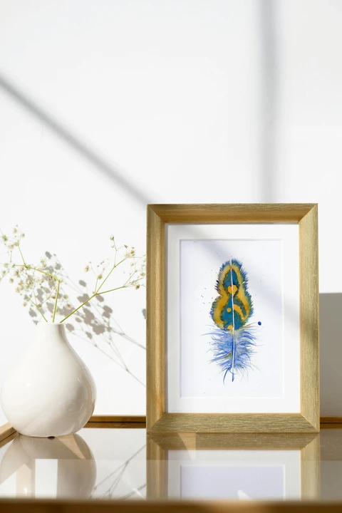 Image of a feather watercolor painting by Shayna Larsen, originals & prints available
