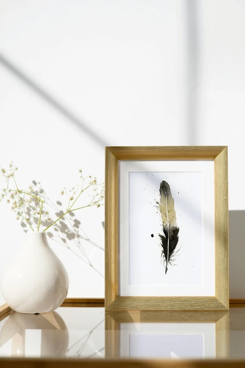Image of a feather watercolor painting by Shayna Larsen, originals & prints available