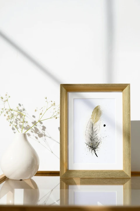 Image of a feather watercolor painting by Shayna Larsen, originals & prints available