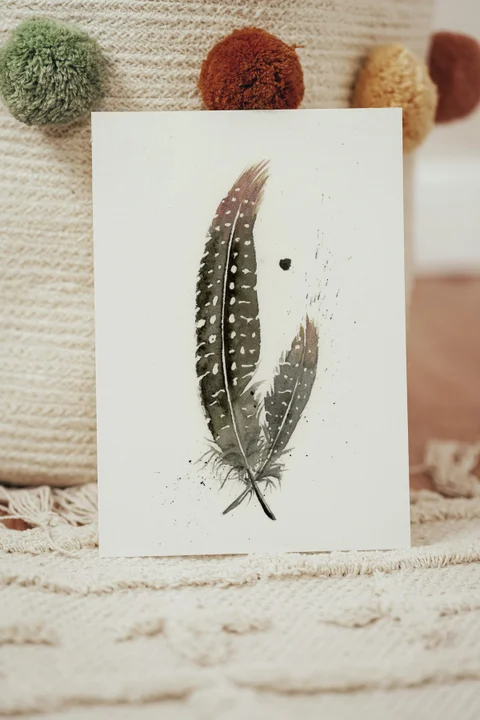 Image of a feather watercolor painting by Shayna Larsen, originals & prints available