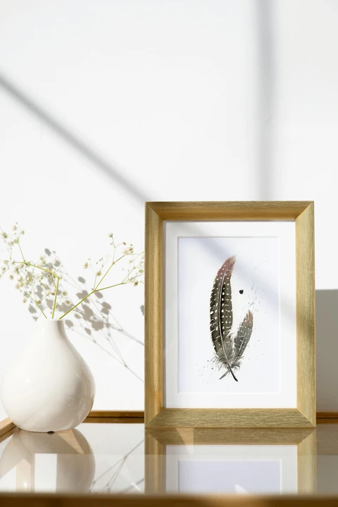 Image of a feather watercolor painting by Shayna Larsen, originals & prints available
