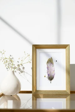 Image of a feather watercolor painting by Shayna Larsen, originals & prints available