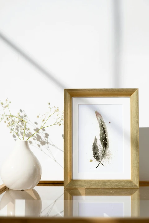 Image of a feather watercolor painting by Shayna Larsen, originals & prints available
