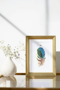 Image of a feather watercolor painting by Shayna Larsen, originals & prints available