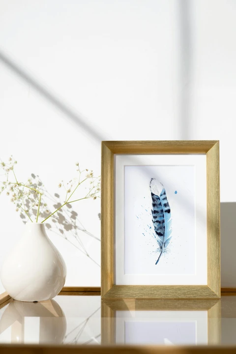 Image of a feather watercolor painting by Shayna Larsen, originals & prints available