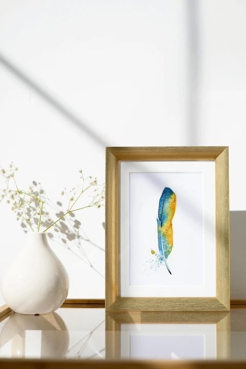 Image of a feather watercolor painting by Shayna Larsen, originals & prints available