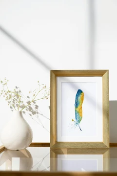 Image of a feather watercolor painting by Shayna Larsen, originals & prints available