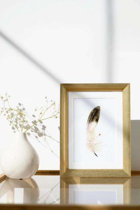 Image of a feather watercolor painting by Shayna Larsen, originals & prints available