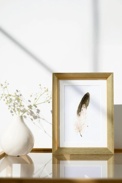 Image of a feather watercolor painting by Shayna Larsen, originals & prints available