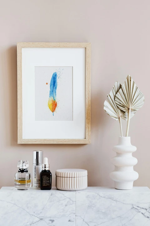 Image of a feather watercolor painting by Shayna Larsen, originals & prints available