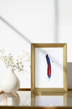 Image of a feather watercolor painting by Shayna Larsen, originals & prints available