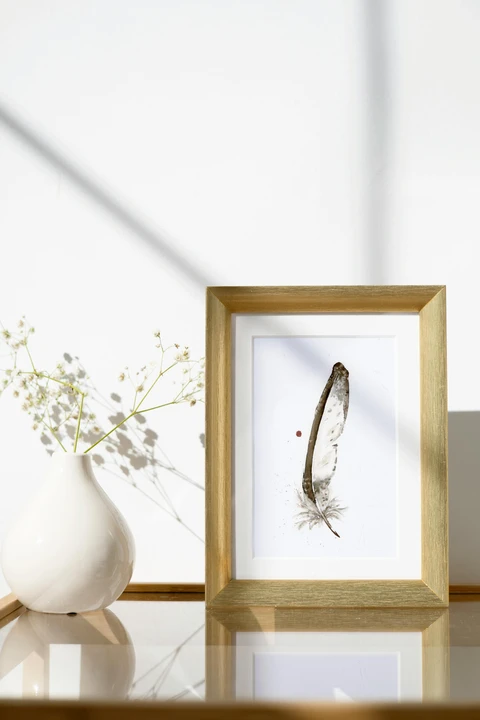 Image of a feather watercolor painting by Shayna Larsen, originals & prints available